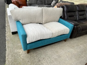 Teal Fabric Loveseat with Mismatched Cushions