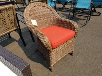 Dark Brown PVC Wicker Arched Back Arm Chair with Orange Seat Cushion
